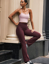 red high-waisted bootcut pants with pockets.